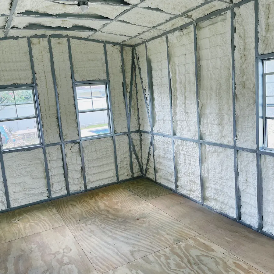 Closed-cell spray foam insulation applied to wall cavities in a residential project in Corning